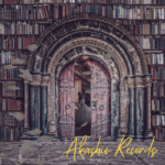 A picture of a library with many shelves and books on them. An archway is at the center. Pages are flying throughout and there is an open door at the center of the archway. There is a woman in a dress inside the doorway. The words "Akashic Records" are in yellow towards the bottom right of the picture.